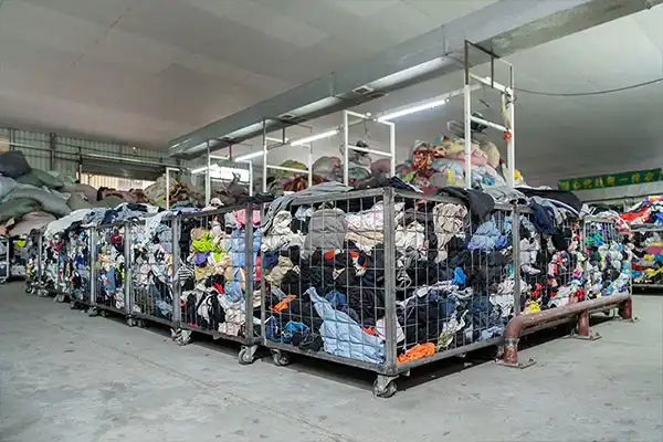several baskets of used clothing for sorting