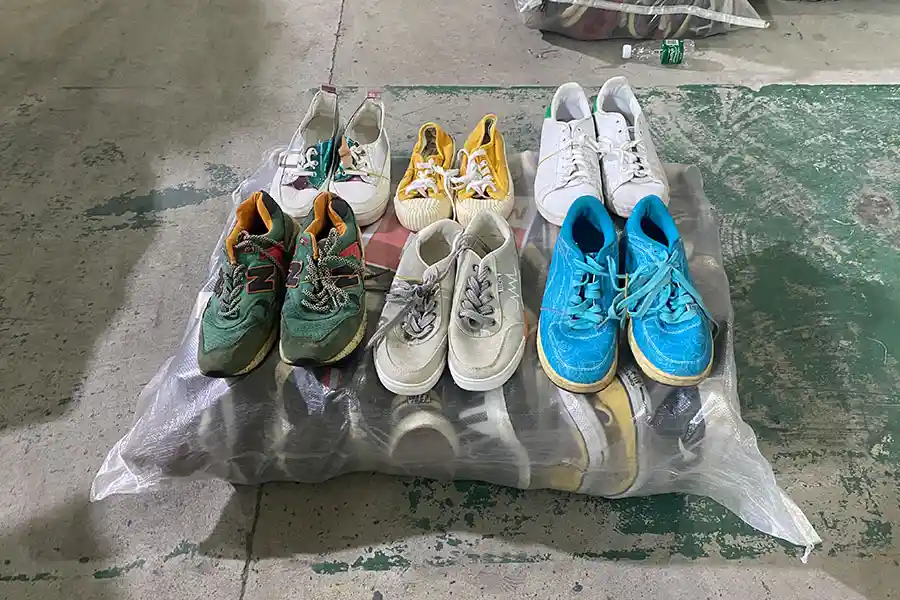 Assorted used sports shoes for men and women