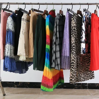 brightly-colored used women's skirts hanging on a rack
