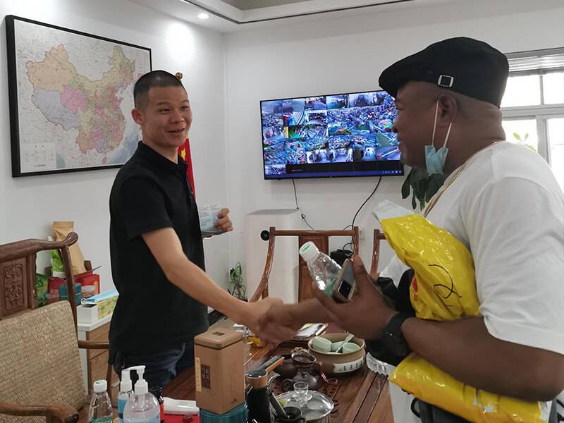 HissenGlobal staff shaking hands with a visiting client