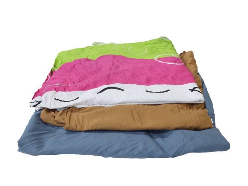 sheets of colored bedsheet rags folded and stacked neatly