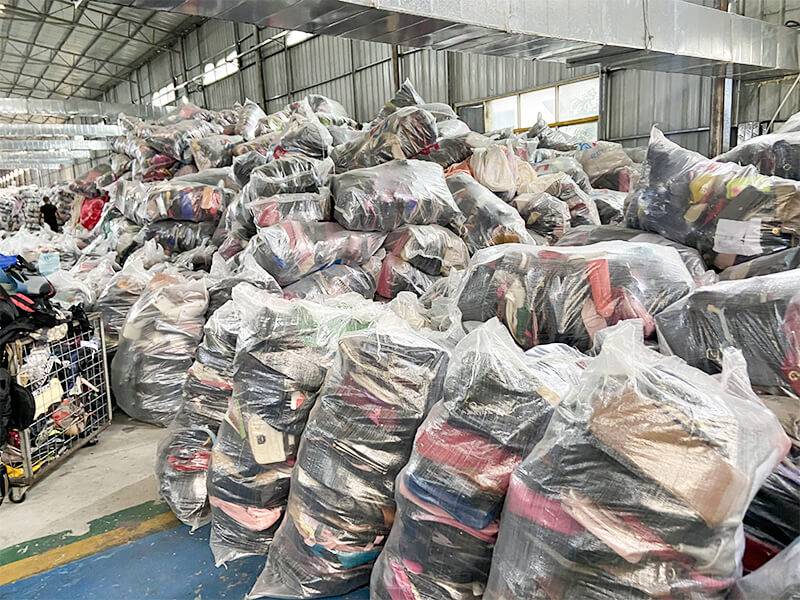 stacks of used clothes prepared by expert sorters