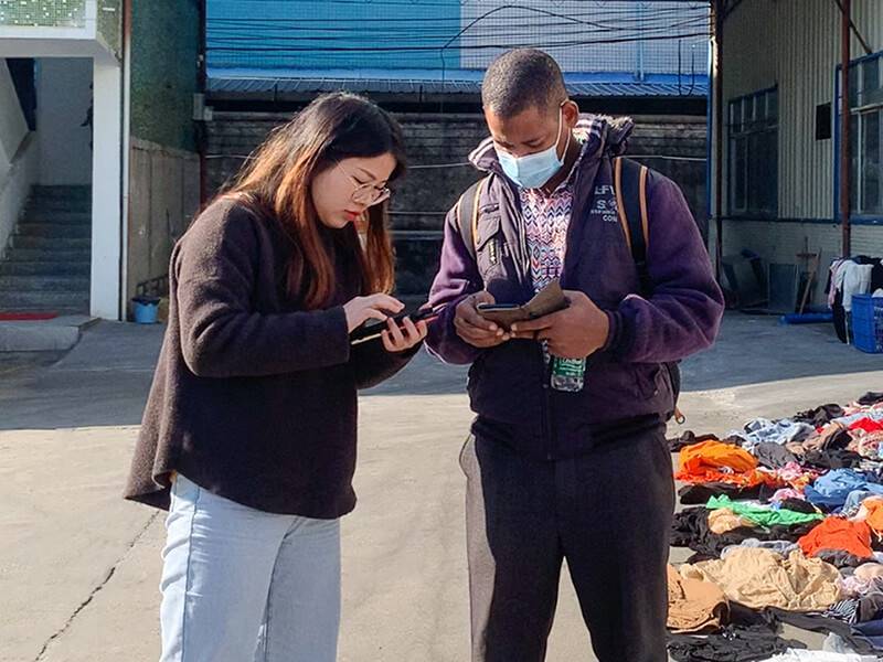 customer and staff exchanging information outside the facility