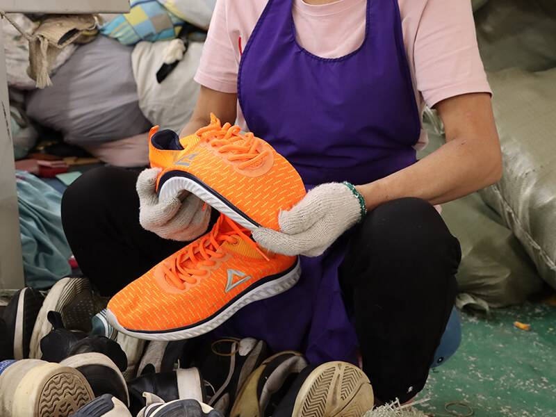 expert sorters testing the used shoe for quality and durability