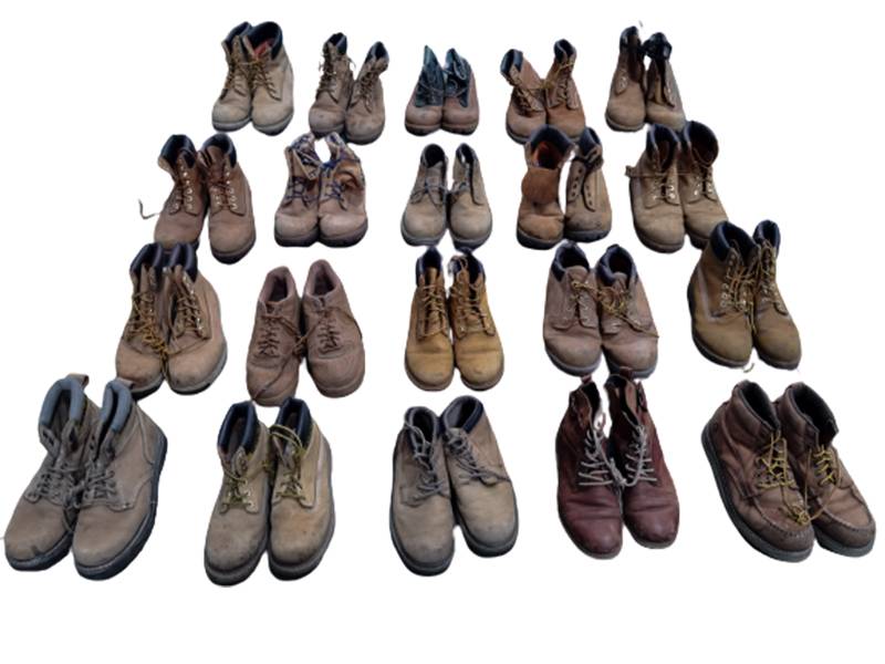 rows of brown used leather shoes ready for packing